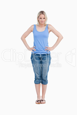 Blonde woman placing her hands on her hips