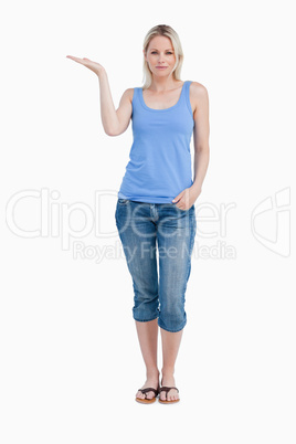Relaxed blonde woman placing her hand palm up