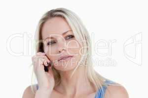 Blonde woman looking to the side while calling