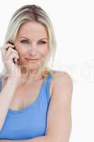 Relaxed blonde woman calling with her cellphone