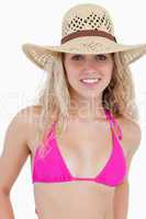 Smiling attractive teenager in beachwear standing upright