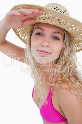 Attractive blonde teenager trying to look far ahead