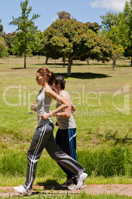 Woman and a man jogging side by side