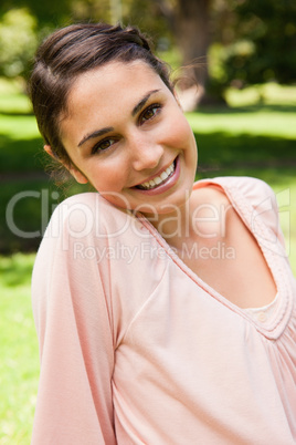 Woman smiling with her head tilted to the side