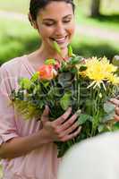 Woman looking at flowers which have been given to her