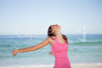 Young woman sunbathing on the beach