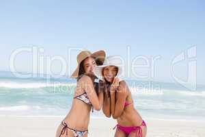 Smiling teenage girls having fun on the beach