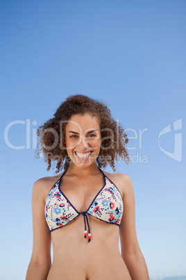Young woman showing a beaming smile in front of the camera