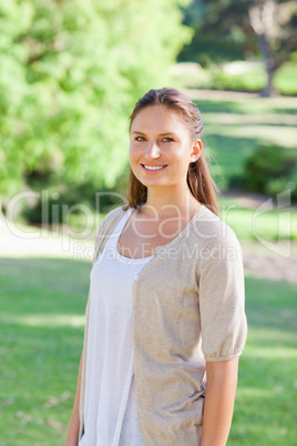 Smiling woman spending her time in the park