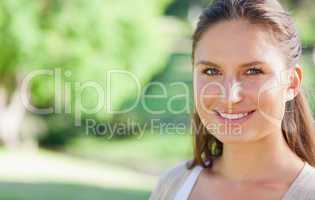 Smiling woman spending her day in the park