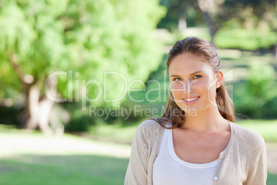 Smiling woman spending her time in the country side
