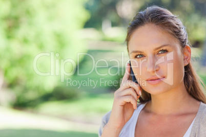 Woman on her phone in the park