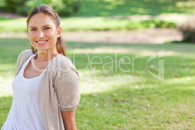 Smiling woman enjoying her time in the park