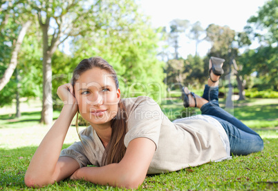 Relaxed woman lying on the grass