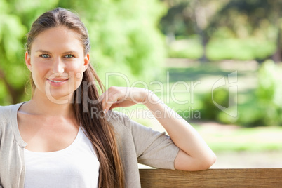 Woman enjoying her time on a park bench