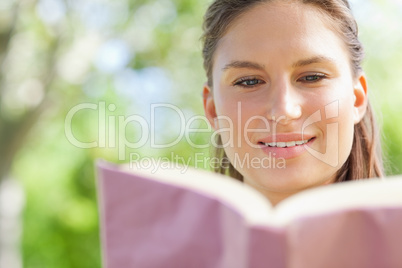 Woman reading her book in the park