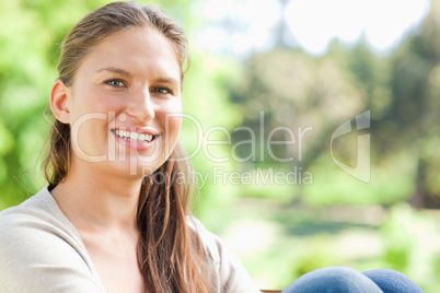 Smiling woman spending her day in the park