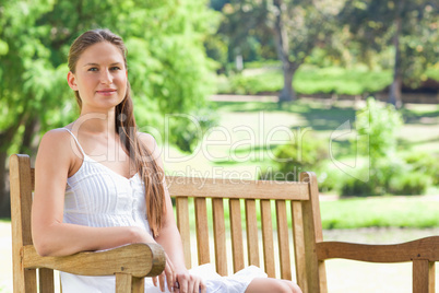 Woman sitting on a bench in the park