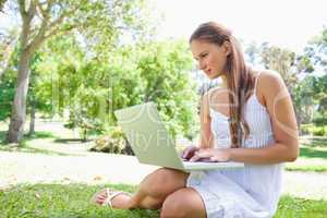 Woman on the lawn with her notebook