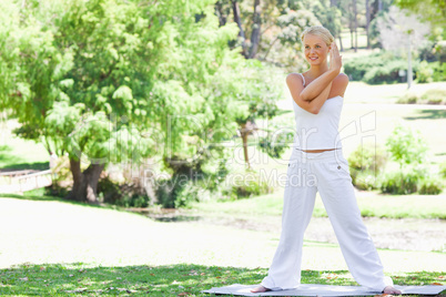 Woman doing her stretches in the park