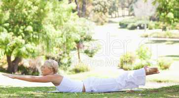 Side view of a woman doing her exercises in the park