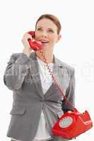 excited businesswoman talking on the phone