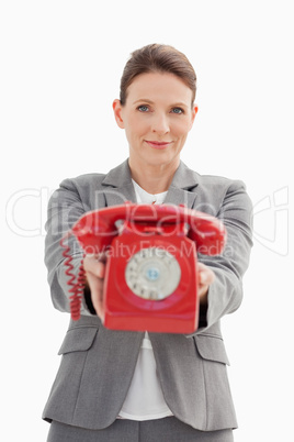 Businesswoman holding out the phone