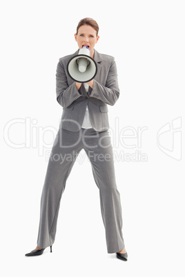 Businesswoman shouting into megaphone