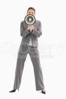 Businesswoman holding megaphone