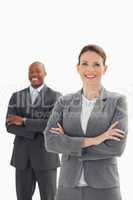 Smiling businesswoman in front of smiling businessman