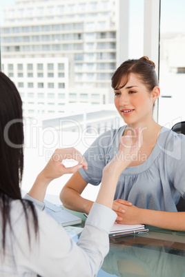 Two business women chat in the office