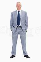 Portrait of a smiling businessman with his hands in his pockets