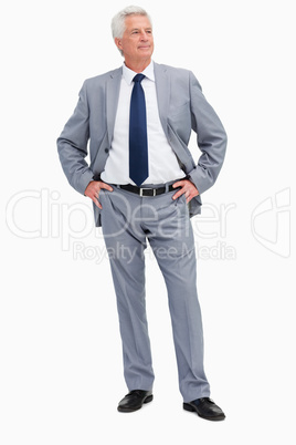 Man in a suit with his hands on his hips