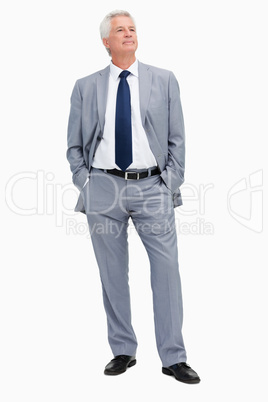 Man in a suit with hands in the pockets