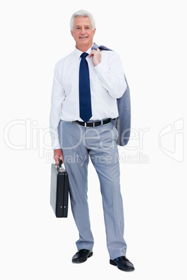 Portrait of a cool businessman with a suitcase