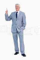 Portrait of a businessman pointing up