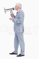 Profile of a businessman speaking with megaphone