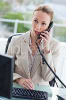 Businesswoman on the phone in her office