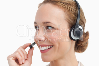 Close-up of a businesswoman talking with a headset