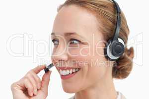 Close-up of a businesswoman talking with a headset