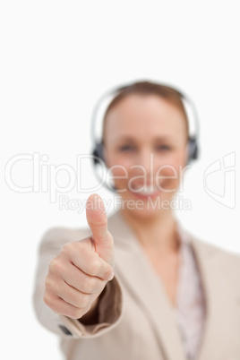 Thumbs up of a businesswoman wearing a headset