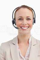 Portrait of a smiling businesswoman wearing a headset