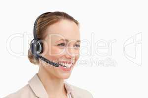 Woman in a suit with headset speaking