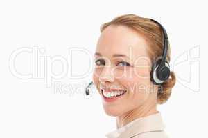 Portrait of a smiling woman in a suit with headset