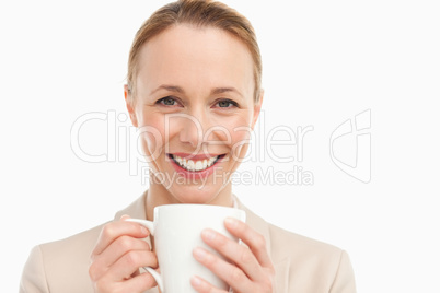 Portrait of a woman in a suit with a mug