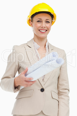 Portrait of a woman in a suit wearing a safety helmet