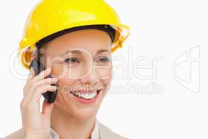 Woman wearing safety helmet on the phone