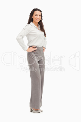 Portrait of a smiling employee arms on hips
