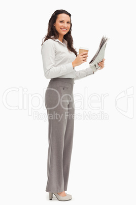 Portrait of an employee with a newspaper and a coffee