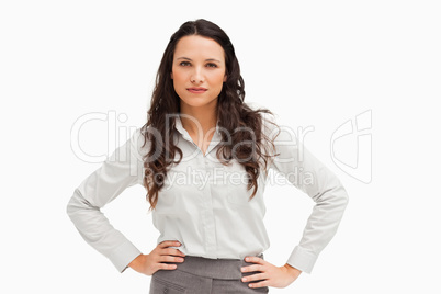 Portrait of a brunette businesswoman hands on hips